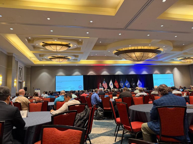 Conference hall at IEEE MILCOM 2026 in Washington, D.C.